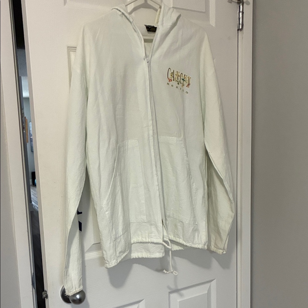 White zippered hoodie. Cancun graphics on front,back and sleeves. 100% cotton